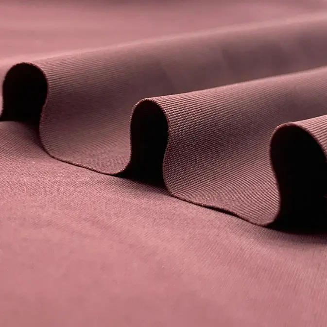 Warp knitted nylon lycra elastic fabric with double warp flat ice silk and quick-drying casual sports fabric (4).jpg